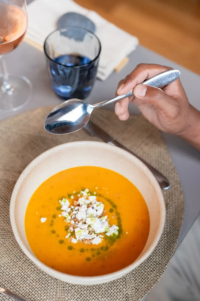 Creamy pumpkin soup with cheese and nuts